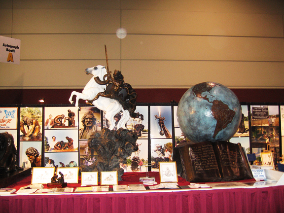 Sculpture display with a globe and horse, with circular light spots (angel orbs) in the photograph