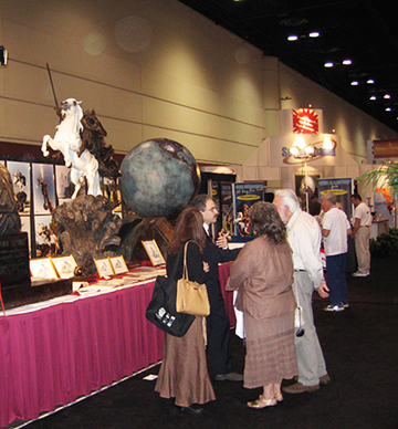Visitors beside an art exhibition display
