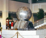 The Great Commission® sculpture displayed indoors behind stanchions