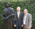 Two men posing beside Fisher of Men® outdoors