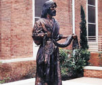 Fisher of Men® holding a net outside a brick church