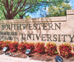 Southwestern university entrance sign surrounded by flowers