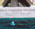 Close view of the Great Commission Fountain inscription above the water