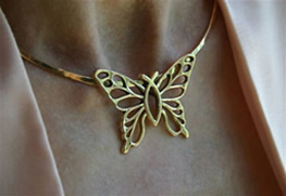 Christian Butterfly® necklace worn at the neck