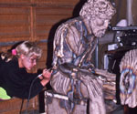 Worker refining the seated Peter figure