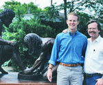 Two men beside Divine Servant® outdoors