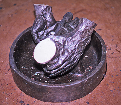 Detail of the sculpted foot and basin in Divine Servant®
