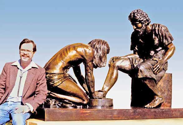 Max Greiner beside a large Divine Servant® sculpture