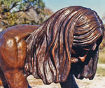 Close-up of Jesus' downturned face and long hair in Divine Servant®