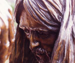 Close-up of Jesus' downturned face and long hair in Divine Servant®