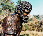 Profile detail of Peter's curly hair, beard and robe