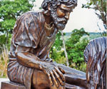 Peter's seated figure with his hand resting on his raised knee