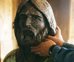 Artist refining the face and hair of the Fisher of Men® model