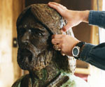 Artist refining the face and hair of the Fisher of Men® model