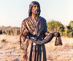 Fisher of Men® holding a fishing net in a natural landscape