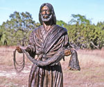 Fisher of Men® holding a fishing net in a natural landscape