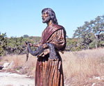 Fisher of Men® holding a fishing net in a natural landscape