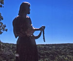 Fisher of Men® silhouetted against the bright sky