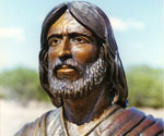 Close-up of the bronze face, beard and robe collar of Fisher of Men®