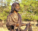 Upper-body view of Fisher of Men® holding the fishing net outdoors