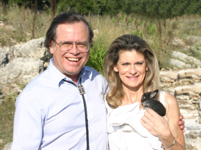Max and Sherry Greiner outdoors holding a small rabbit