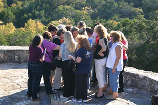 Sherry Greiner with a group of women on a stone terrace