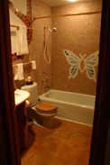 Bathroom with a butterfly design on the shower enclosure