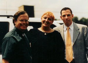 Max Greiner posing with a woman and man
