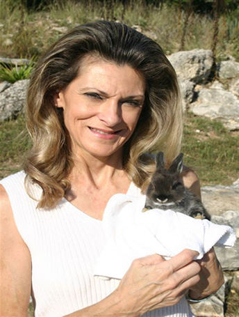 Sherry Greiner holding a white rabbit with dark ears