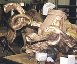 Large hollow cast-metal sections awaiting assembly