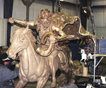 Large cast sections of the rider's cloak beside the metal horse