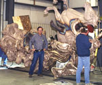 Workers beside the large horse and separate cast sculpture sections