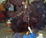 Rear view of the rider's flowing cloak during surface finishing