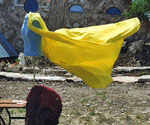 Yellow cloth stretched between supports as a reference for the rider's cloak