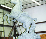 Side view of the horse and rider armature, with the flowing cloak taking shape