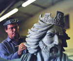 Artist shaping the crowned rider's head and flowing hair