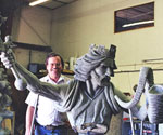Artist behind the crowned rider's head and flowing cloak