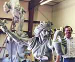 Full workshop view of the artist beside the horse-and-rider sculpture
