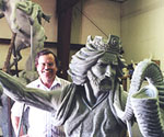 Artist behind the rider's crowned head and flowing clay hair