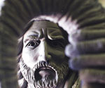 Low-angle detail of The Coming King® model's face framed by flowing hair