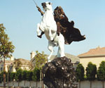 Side view of The Coming King® sculpture in an outdoor courtyard
