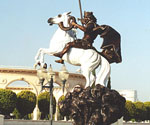 Side view of The Coming King® sculpture in an outdoor courtyard