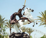 The Coming King® seen from the side among palm trees