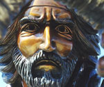 Close-up of The Coming King® rider's bronze face beneath the decorated crown