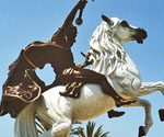 Low-angle view of The Coming King® showing the raised sword and white horse
