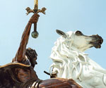 Low-angle view of The Coming King® showing the raised sword and white horse