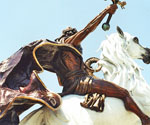 Low-angle view of The Coming King® showing the raised sword and white horse
