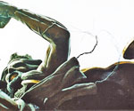 Detail of the rider's outstretched hand holding a loop