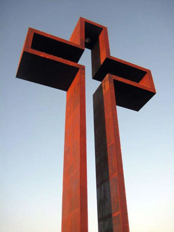 The Empty Cross™ rising against a clear sky