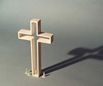 The Empty Cross™ model with tiny figures showing its scale and shadow